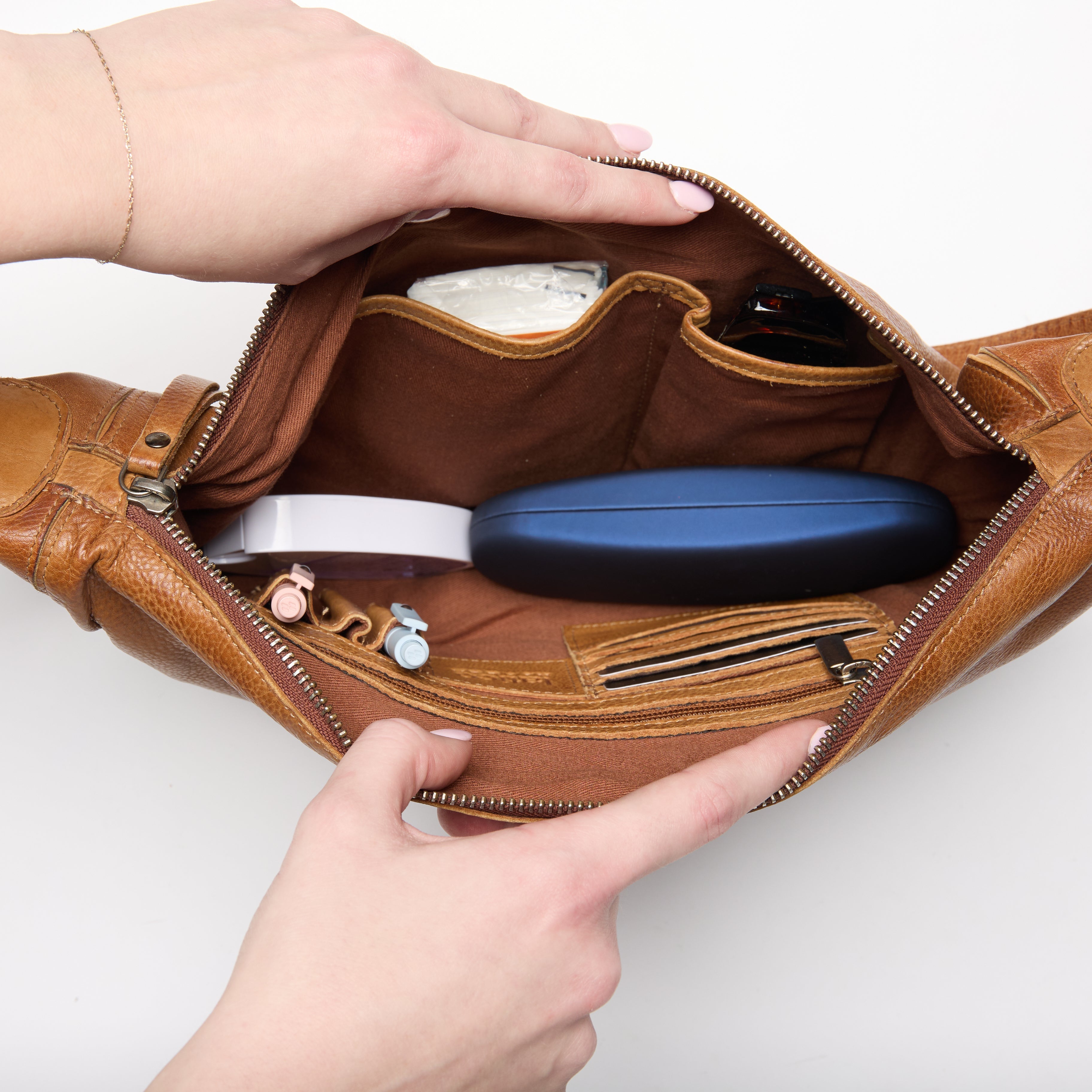 Stuffed interior view of full-grain leather Bonnie concealed carry crossbody bag by Confident Conceal