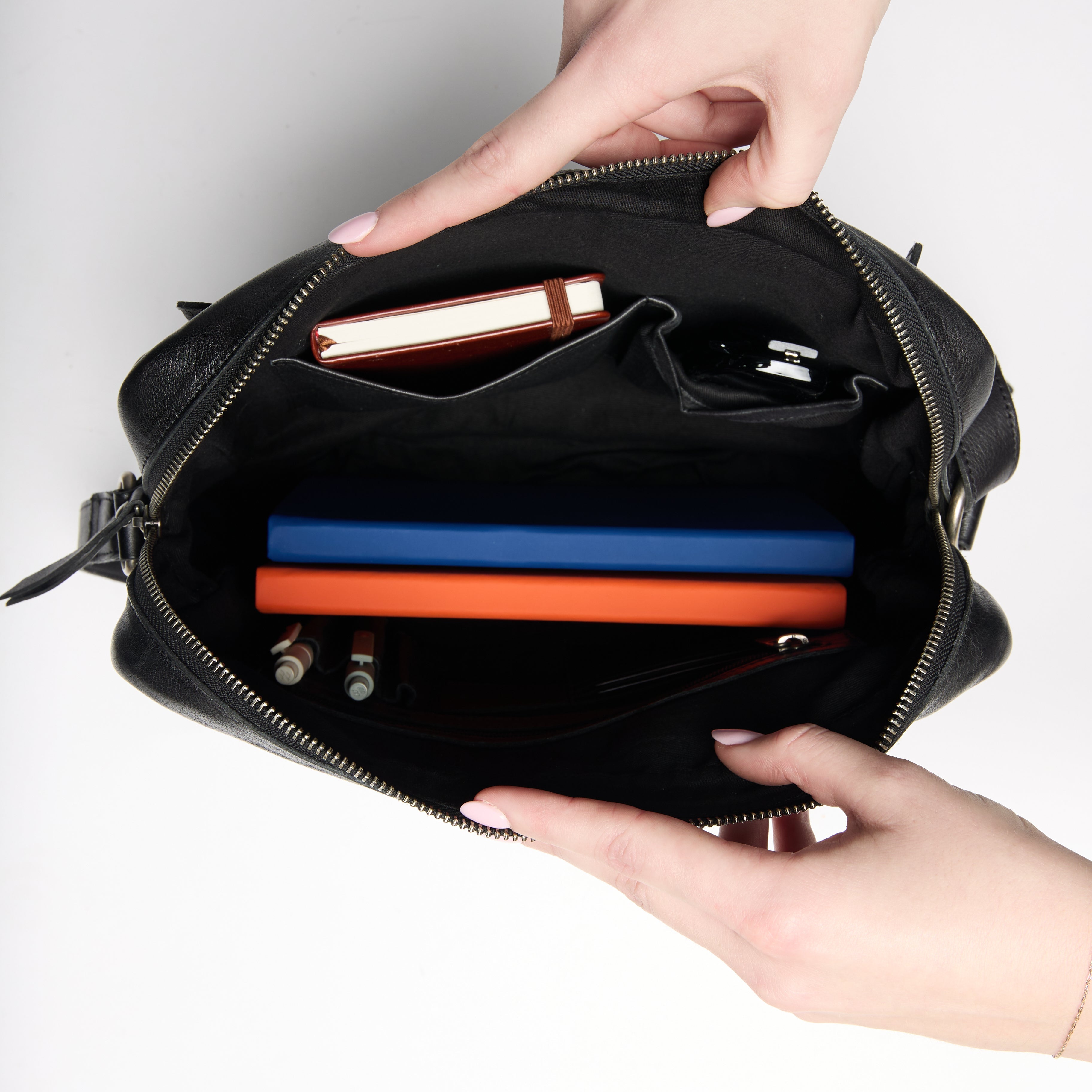 Stuffed interior view of full-grain leather Jessie concealed carry tote bag by Confident Conceal