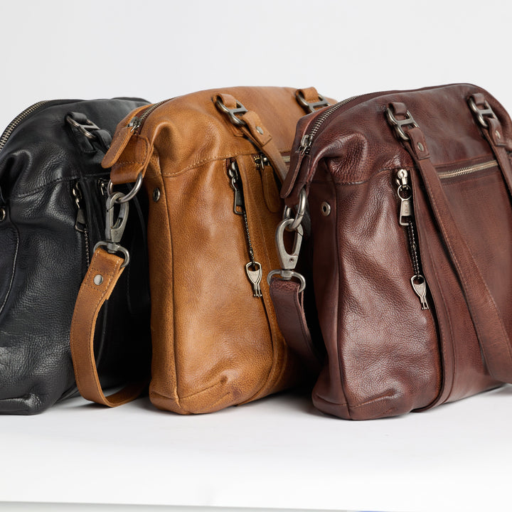 Black, cognac, and brown full-grain leather Athena concealed carry tote bags by Confident Conceal