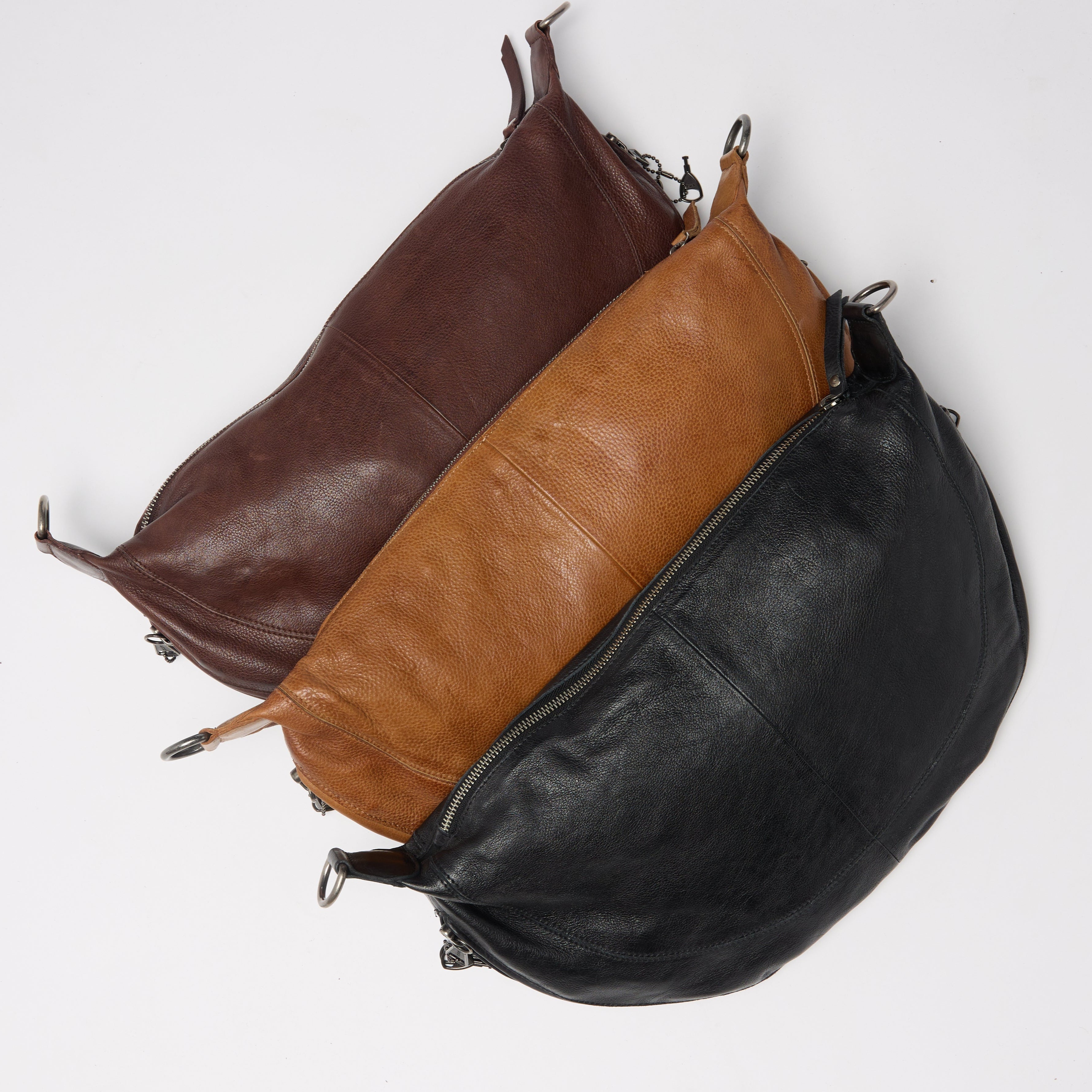 Brown, cognac, and black full-grain leather Bonnie crossbody bags by Concealed Carry 